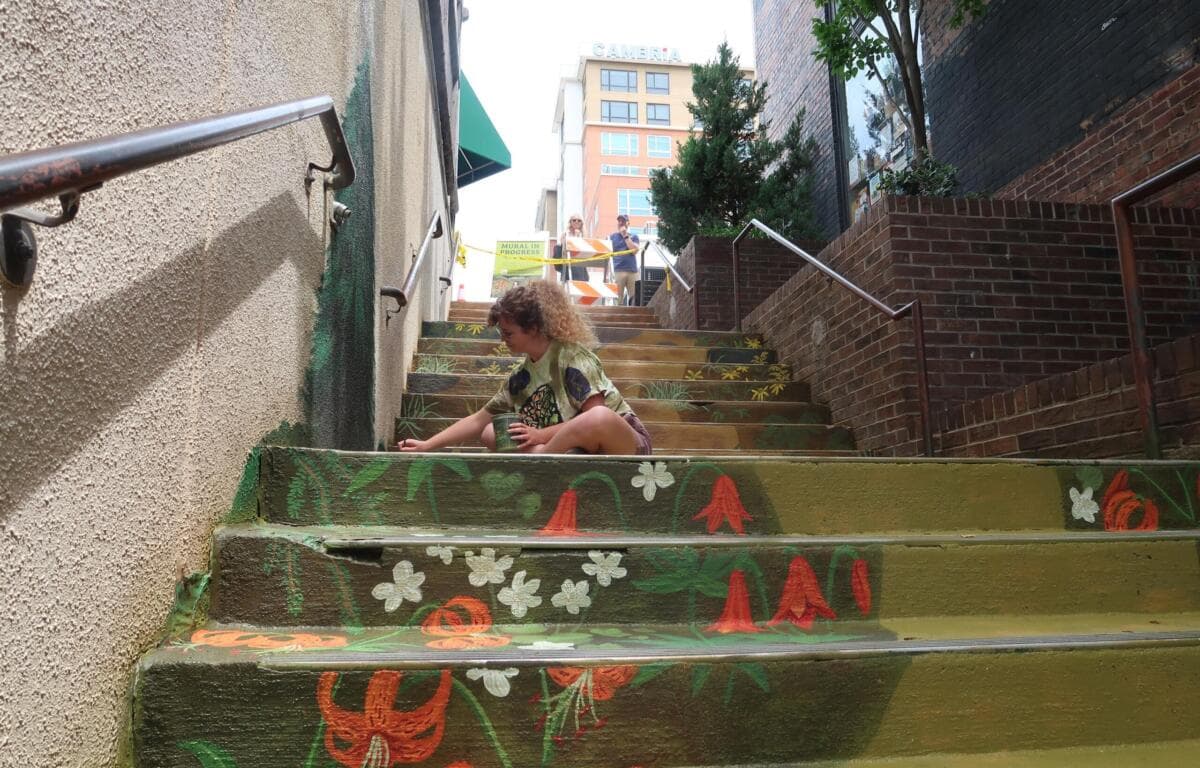 Asheville’s Wall Street steps get a new mural inspired by local ecology