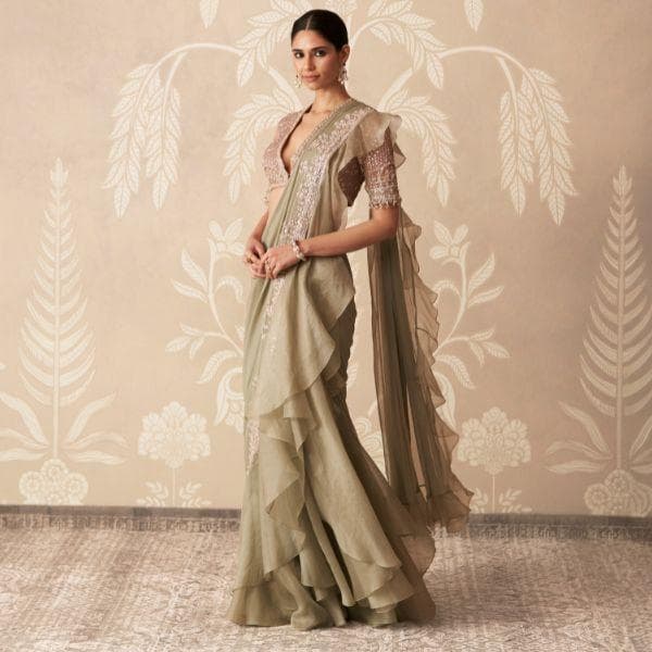 Ruffles, corsetry, and sage green reshape Indian bridal style