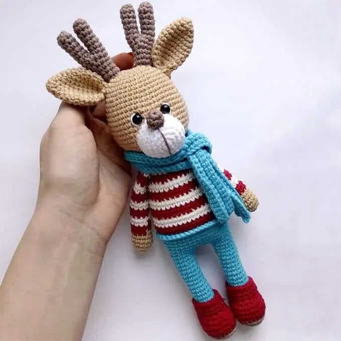 Cute reindeer in a sweater crochet pattern adds cozy holiday charm