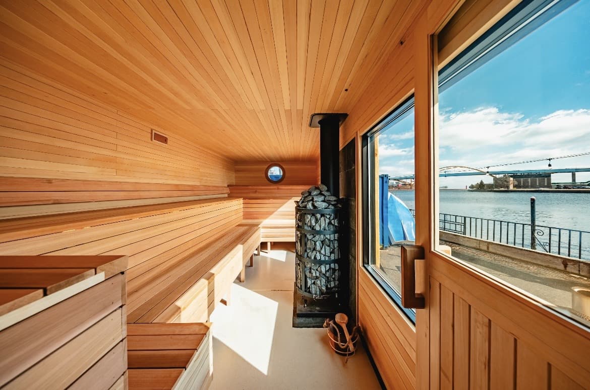 Driftwood Sauna Club opens Milwaukee riverfront saunas with shark-cage cold plunge