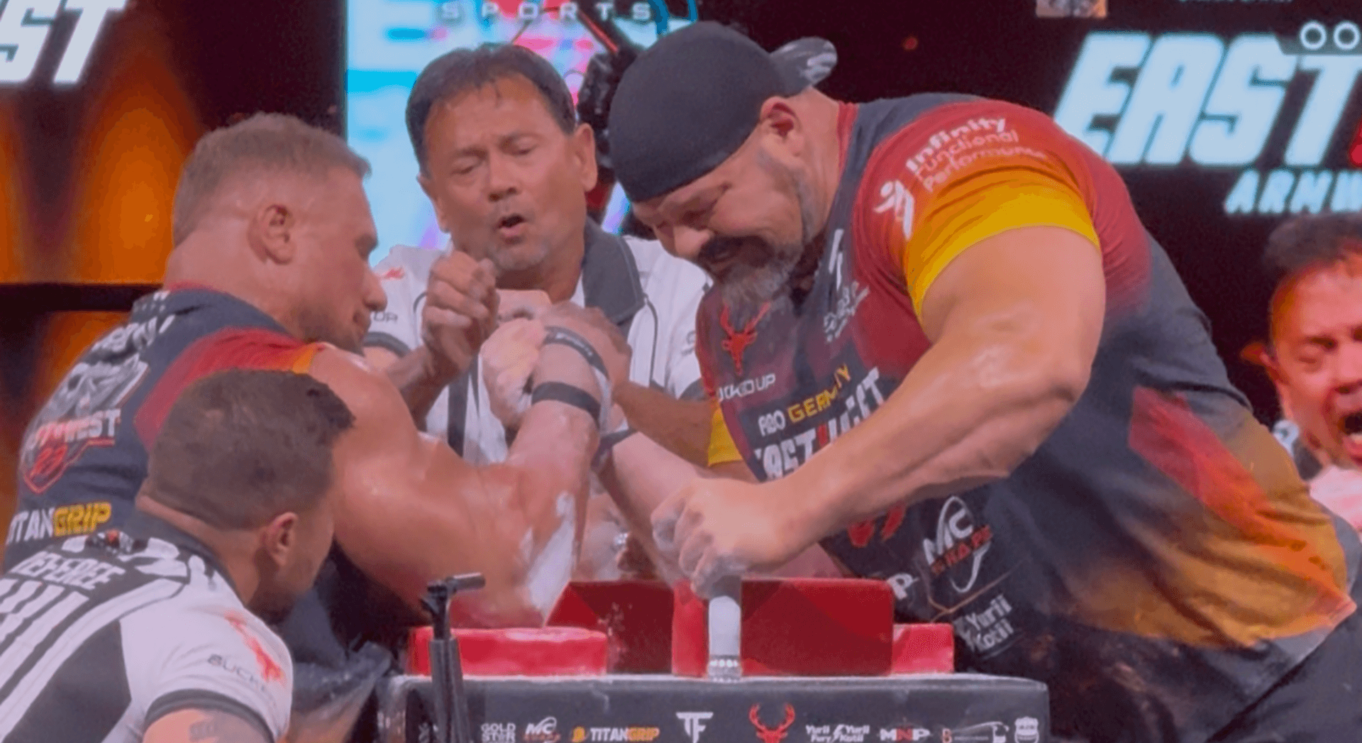 Leonidas Arkona hands Brian Shaw first pro arm-wrestling loss at East vs West 23