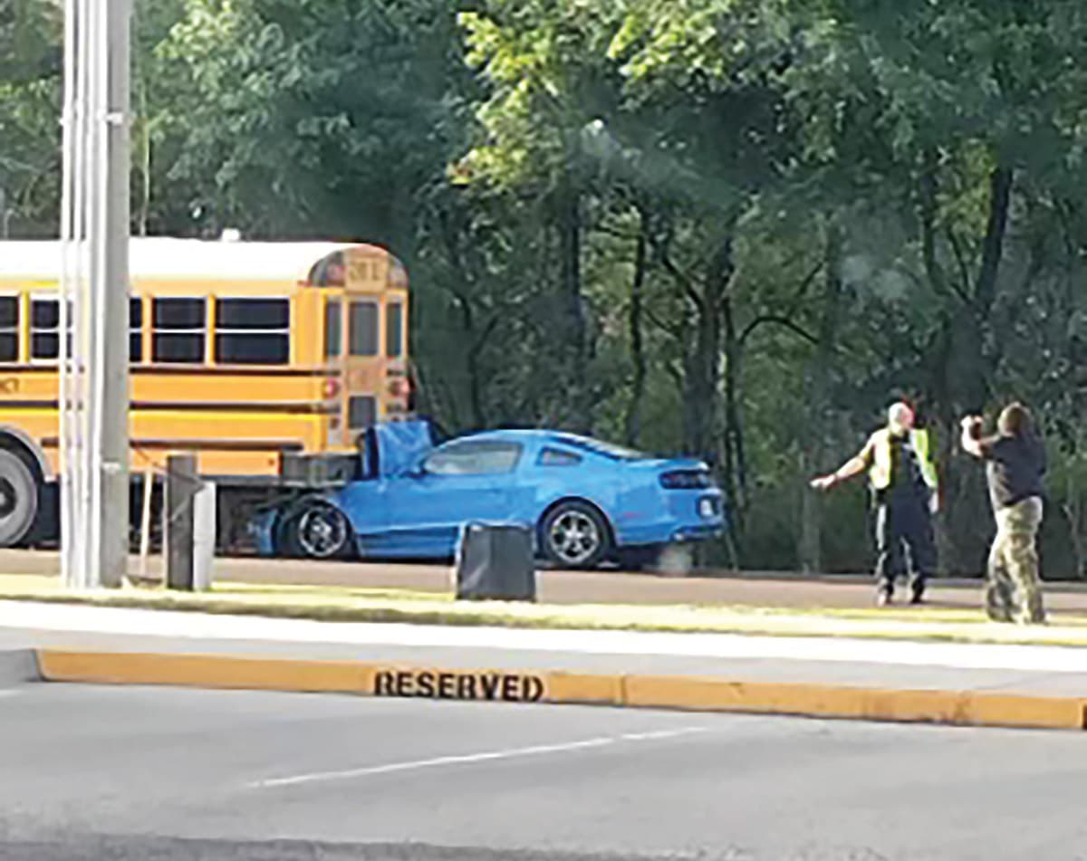 Two killed as car strikes Sanders school bus near Lupton; students uninjured