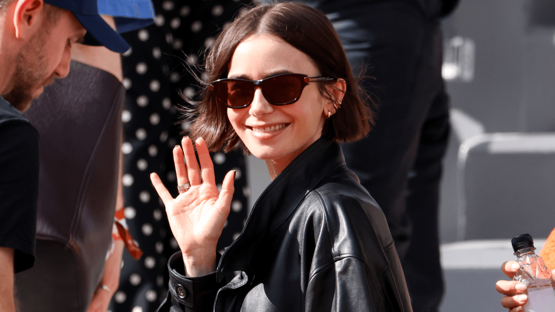 Lily Collins wears Cartier gold Love jewels at the French Open