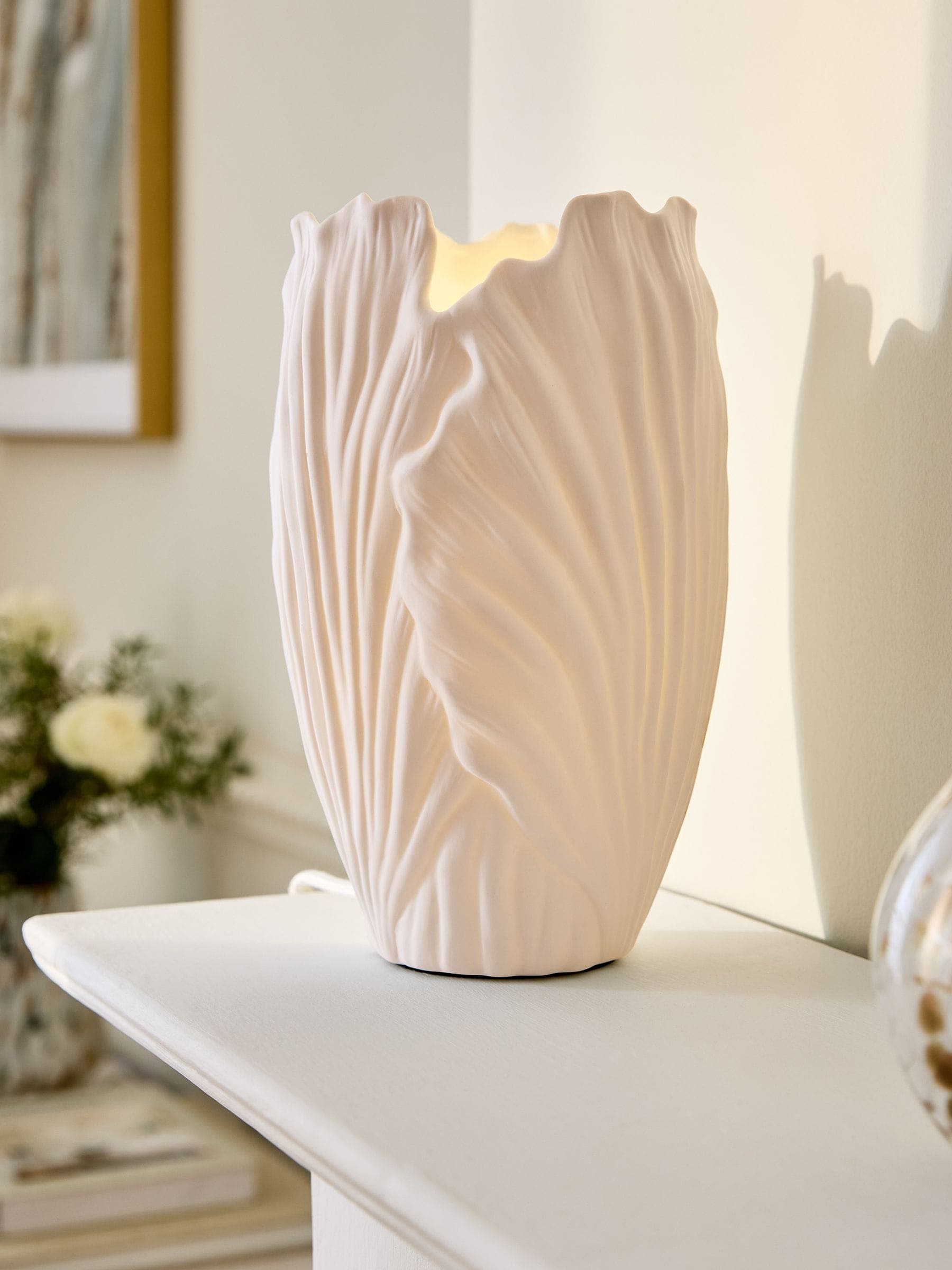 Next sculptural table lamps make stylish housewarming gifts for small spaces