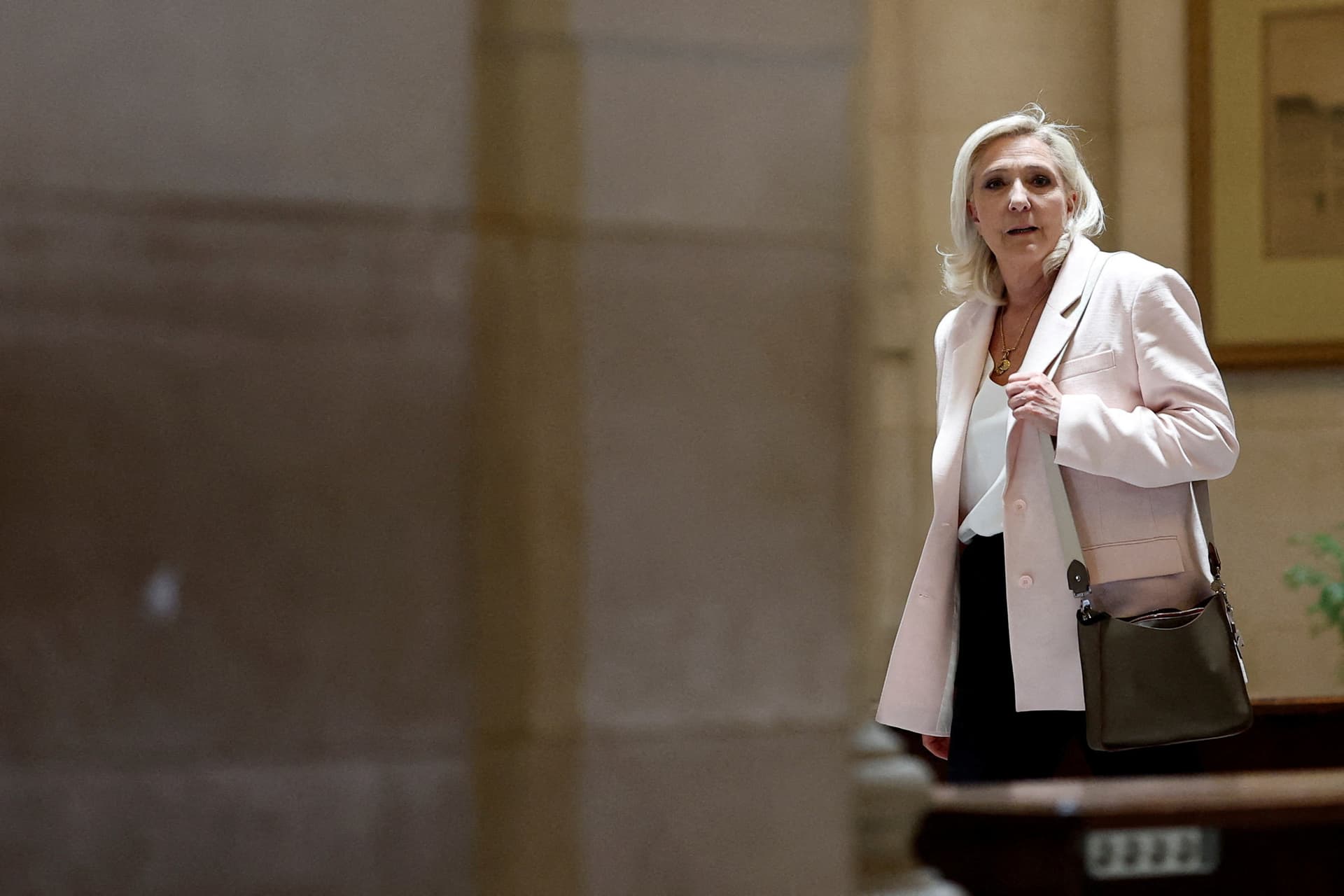 French court upholds Le Pen conviction, eases 2027 election ban