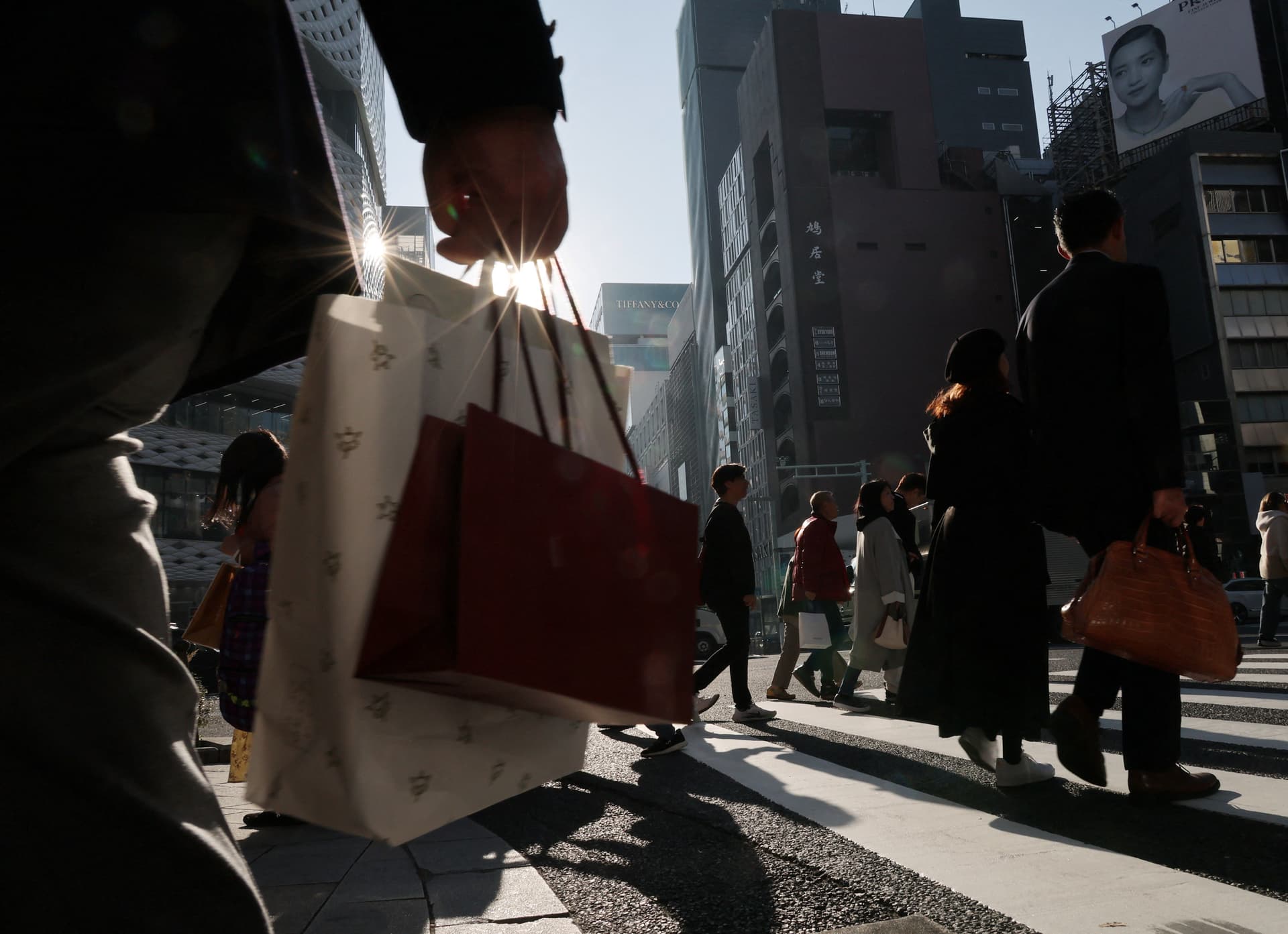 Japan keeps economic view steady, flags Middle East and market risks