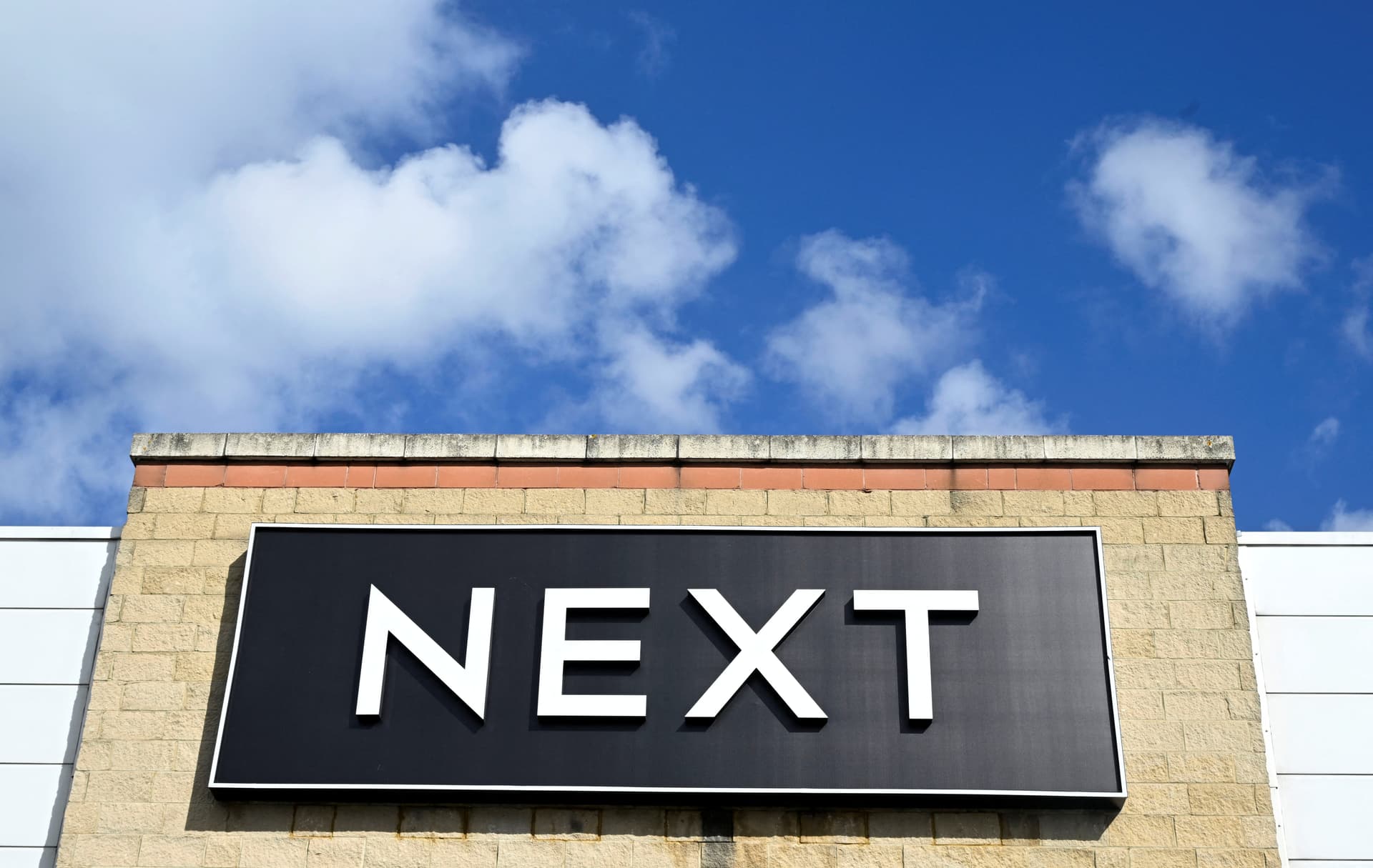 Next raises overseas prices, lifts profit forecast after strong sales