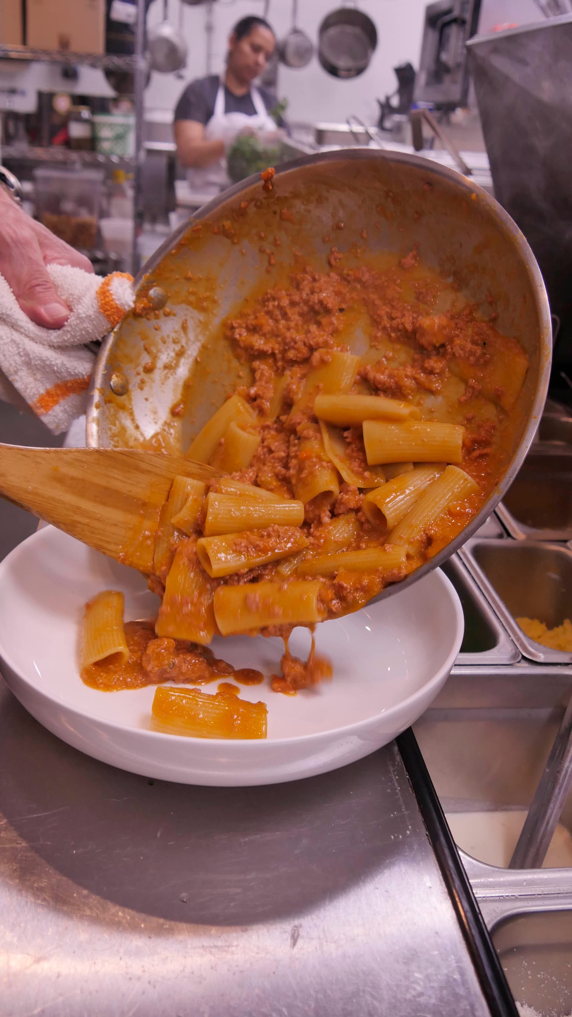 Inside Hank’s Pasta Bar, Darren Norris serves cacio e pepe with chicken