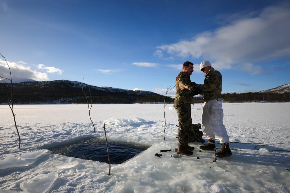 U.S. Marines Brave Icy Cold Plunge During Norway Cold Response Training