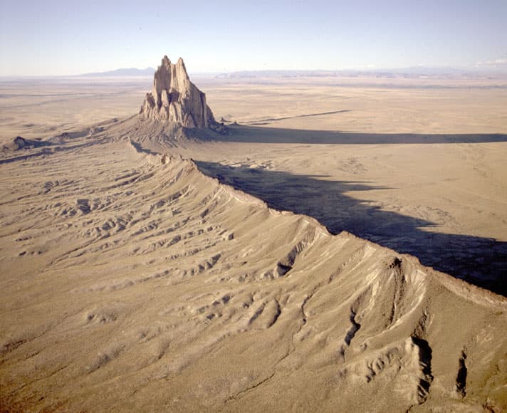 Shiprock’s volcanic history and sacred status shape visitor etiquette