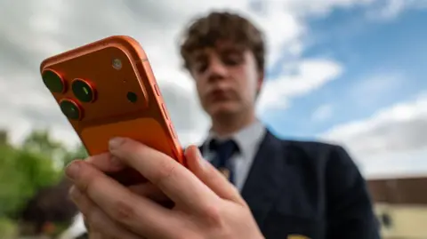 UK considers age limits for social media, gaming and AI chatbots