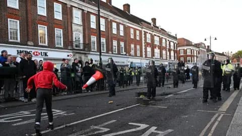 Riot police deployed in Epsom after protest over rape suspects descriptions