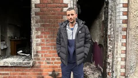 Belfast unrest forces families from homes after knife attack