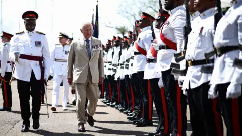 King Charles Welcomed in Bermuda With Schoolchildren, Birds and Bob Marley