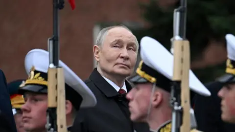 Putin uses scaled-back Victory Day parade to justify Ukraine war, denounce NATO