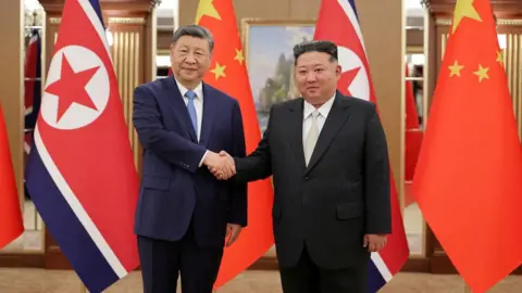 Xi visits Pyongyang, vows support for Kim as ties deepen