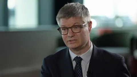 Next boss warns UK entry-level jobs will shrink as AI grows