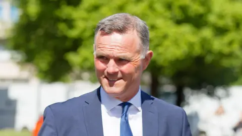 Grand National trainer jailed for attacking dog walker with hockey stick