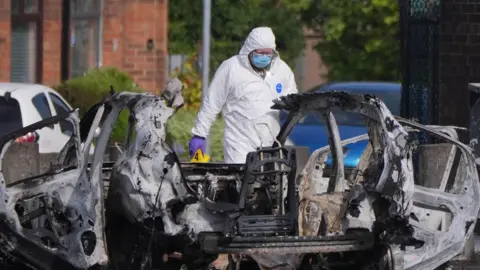 Northern Ireland Police Step Up Checkpoints After Dunmurry Car Bomb Attack