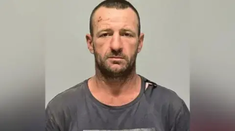Body found in NSW may be fugitive wanted over triple murder