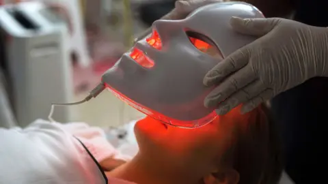Red light therapy booms as science weighs skin and muscle claims