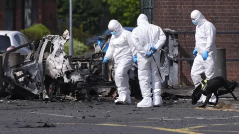 Father evacuates children as bomb explodes outside Dunmurry police station