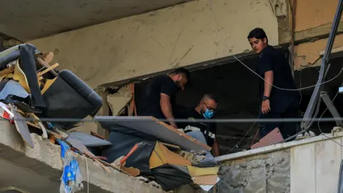 Israel strikes Beirut suburbs after Hezbollah fires at northern Israel
