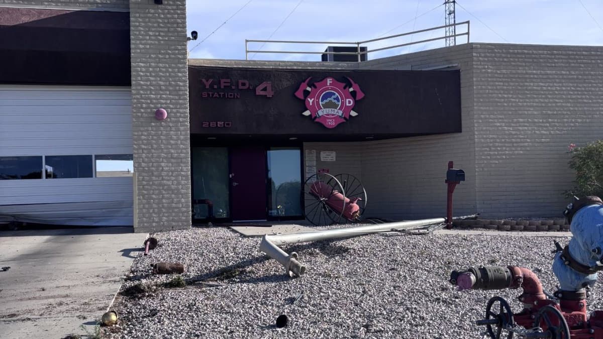 Driver crashes near Yuma Fire Station, damaging bay door, prompting hospital transport