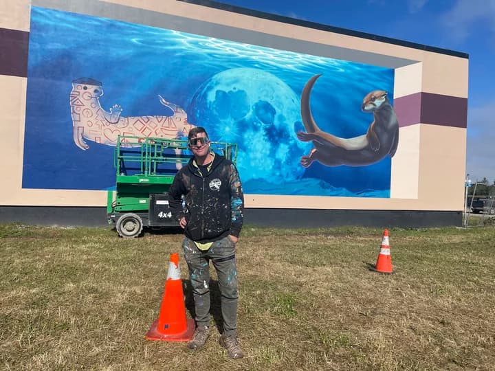 Eureka muralist paints otter-space mural for city arts festival