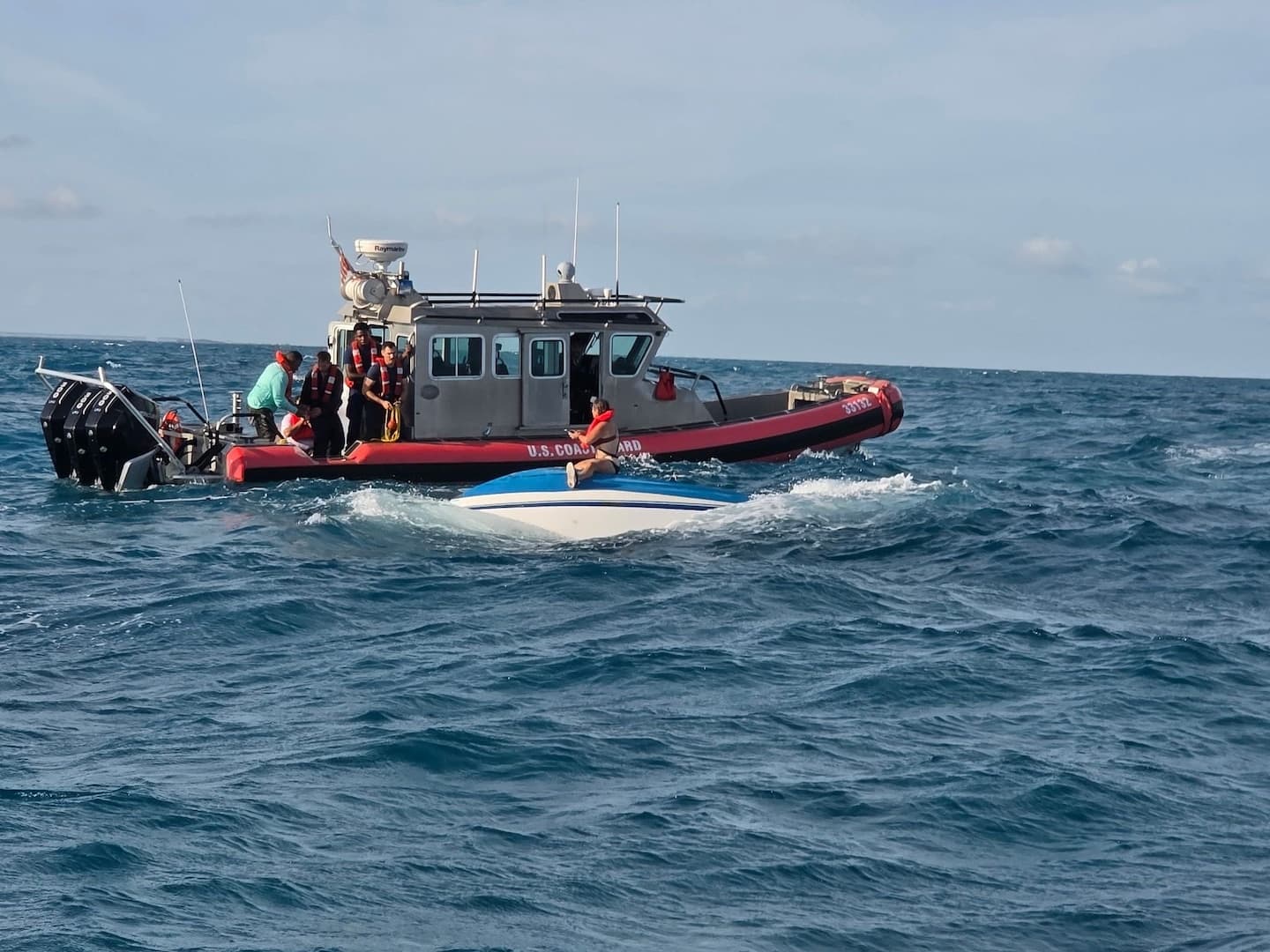 Coast Guard rescues three after boat capsizes near Little Palm Island