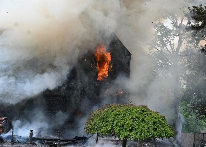 Walden fire heavily damages three-story building, firefighter burned