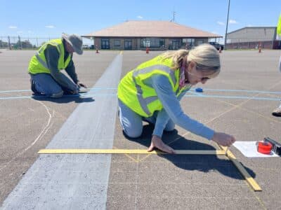 Lawrence Regional Airport to paint sunflower compass rose for pilots
