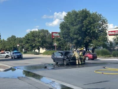 Car fire after crash reroutes traffic in North Lawrence