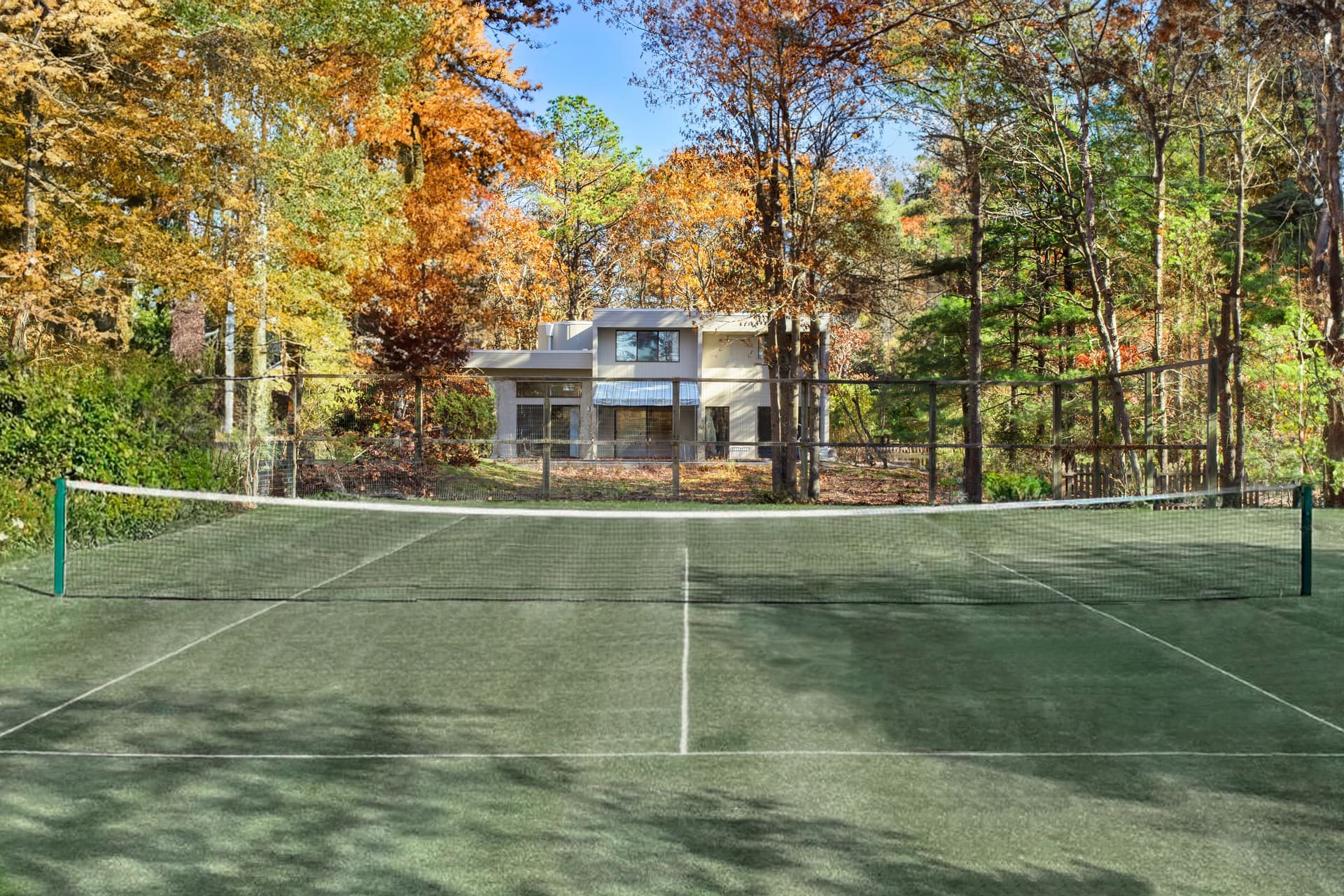 Quogue Village rental lists with full-size tennis court, pool