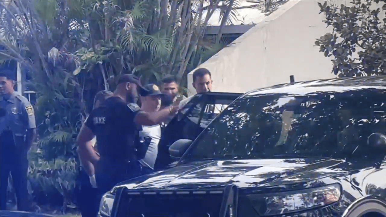 Stolen truck chase ends with lake jump and arrest in Miami-Dade