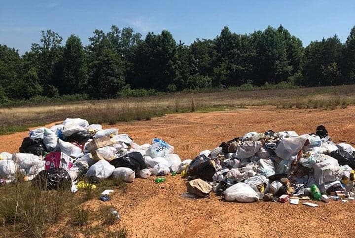 Conservation officer finds illegal dump near Patoka River, cleanup follows