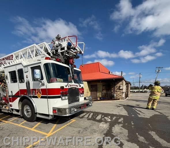 Small Box Fire Spreads Toward Wooden Fence at Chippewa Township Pizza Hut