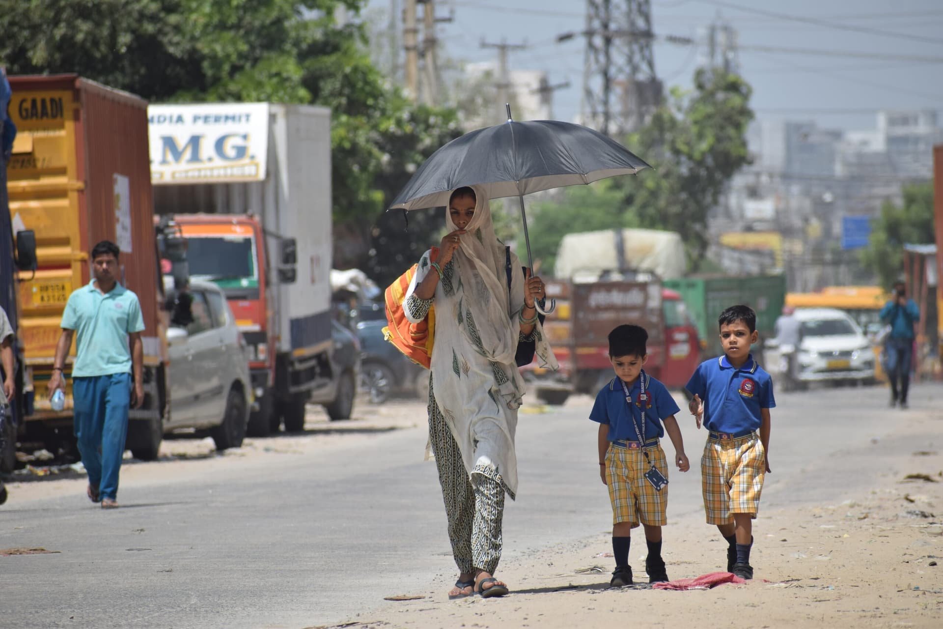 Northern India swelters as heat wave shuts markets, schools, roads