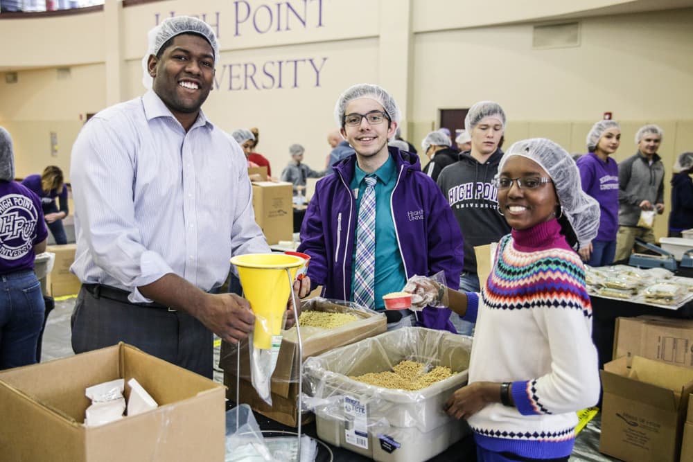High Point University Volunteers Pack Meals, Repaint Classrooms for MLK Day