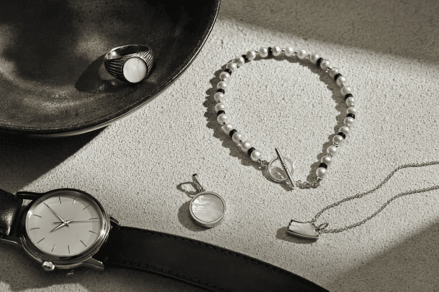 Menswear embraces mother-of-pearl, as pearl jewelry expands beyond classics