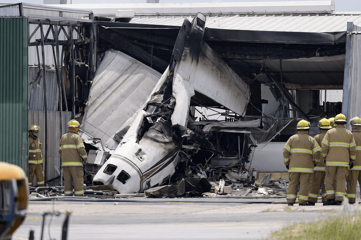 Small plane crashes into Parafield Airport hangar, two dead, ten injured