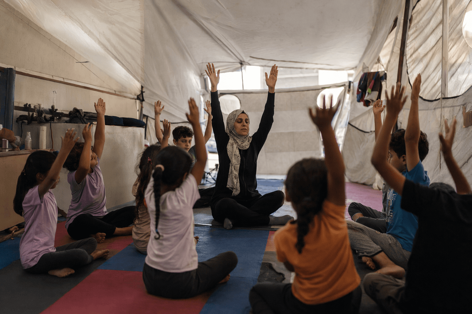 Gaza teacher turns tent into yoga refuge for traumatized children