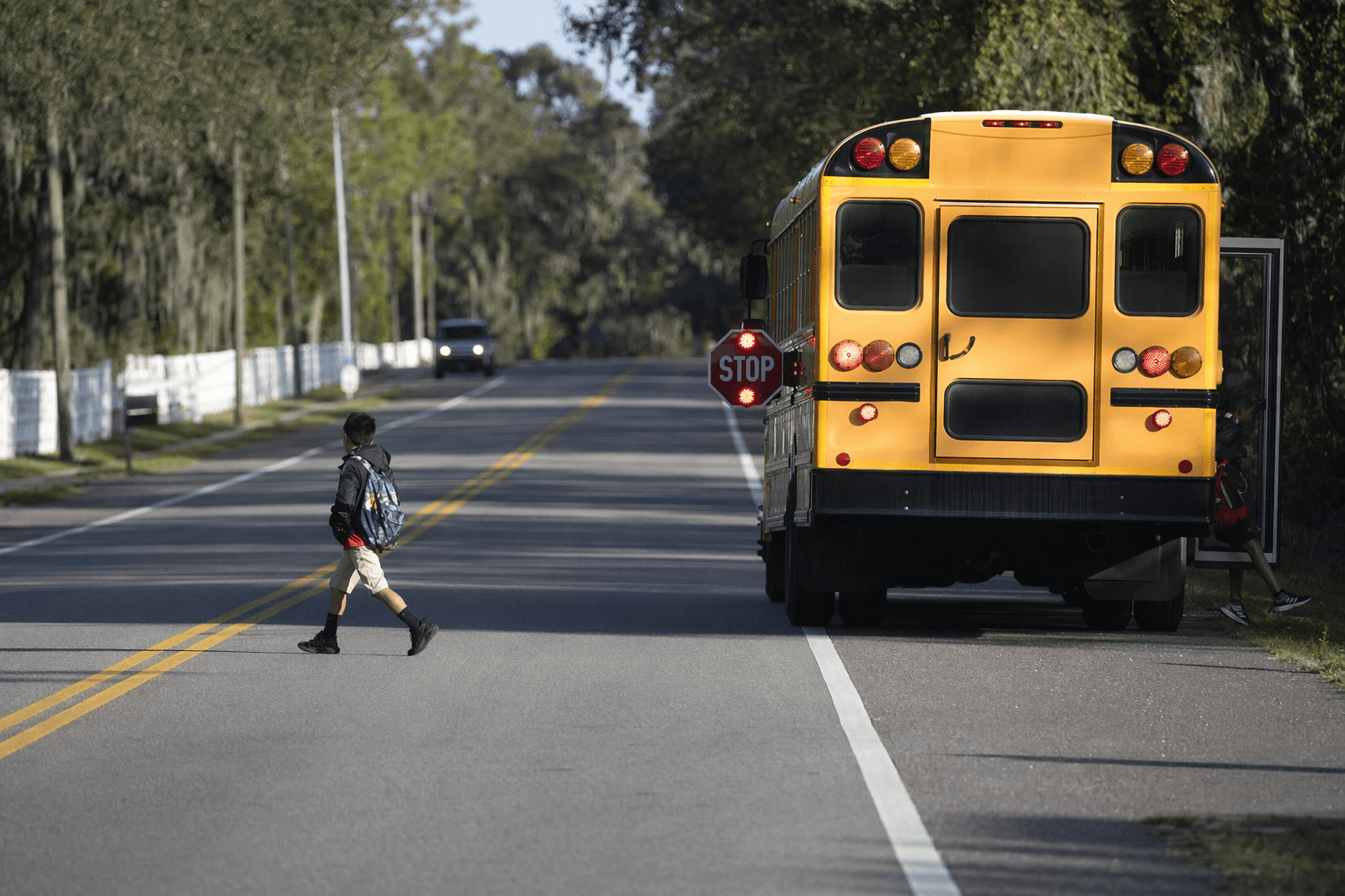 Driver passes stopped school bus, nearly hits child in Florida