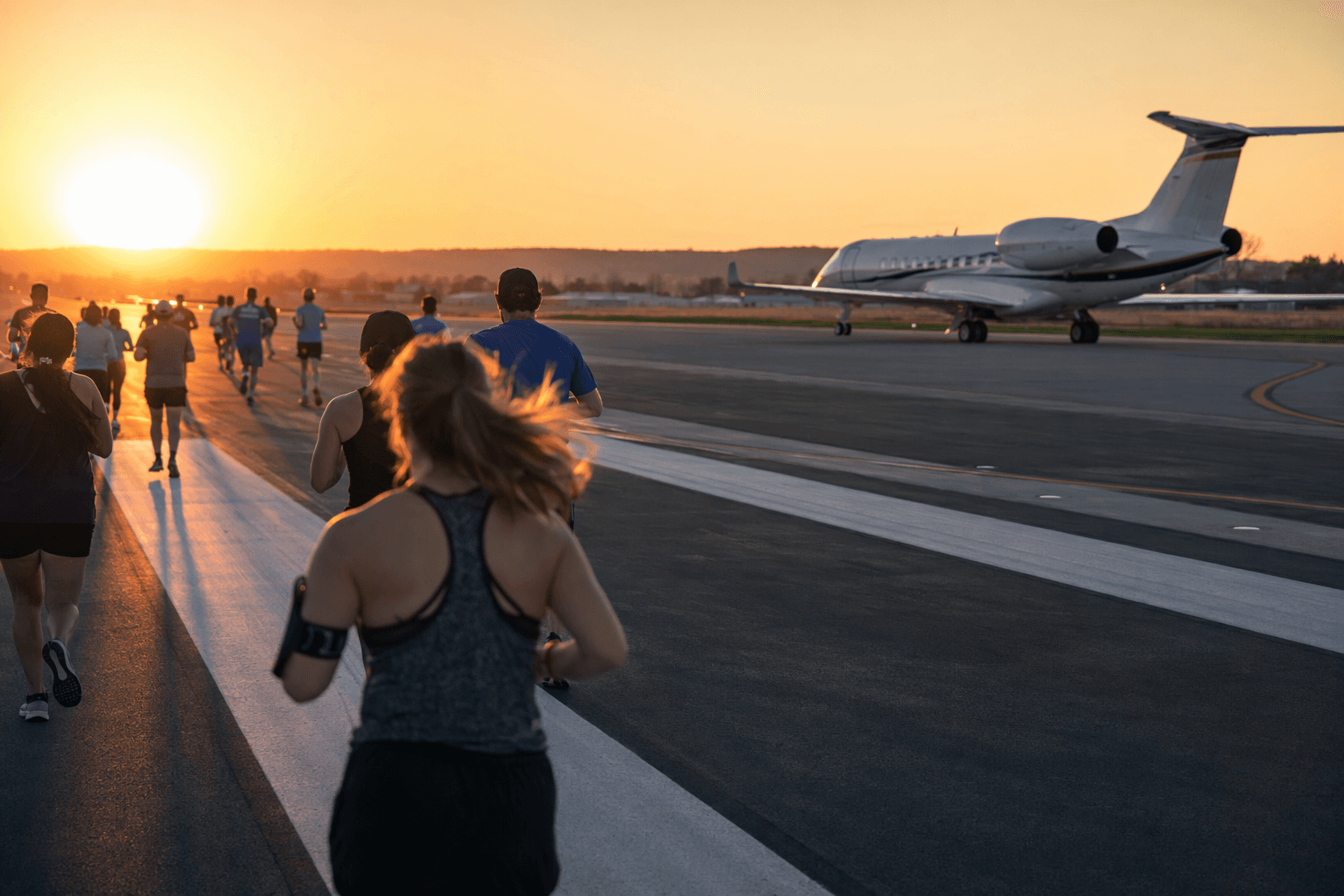 TVC 5K returns, runners cross airport runway for Wings of Mercy