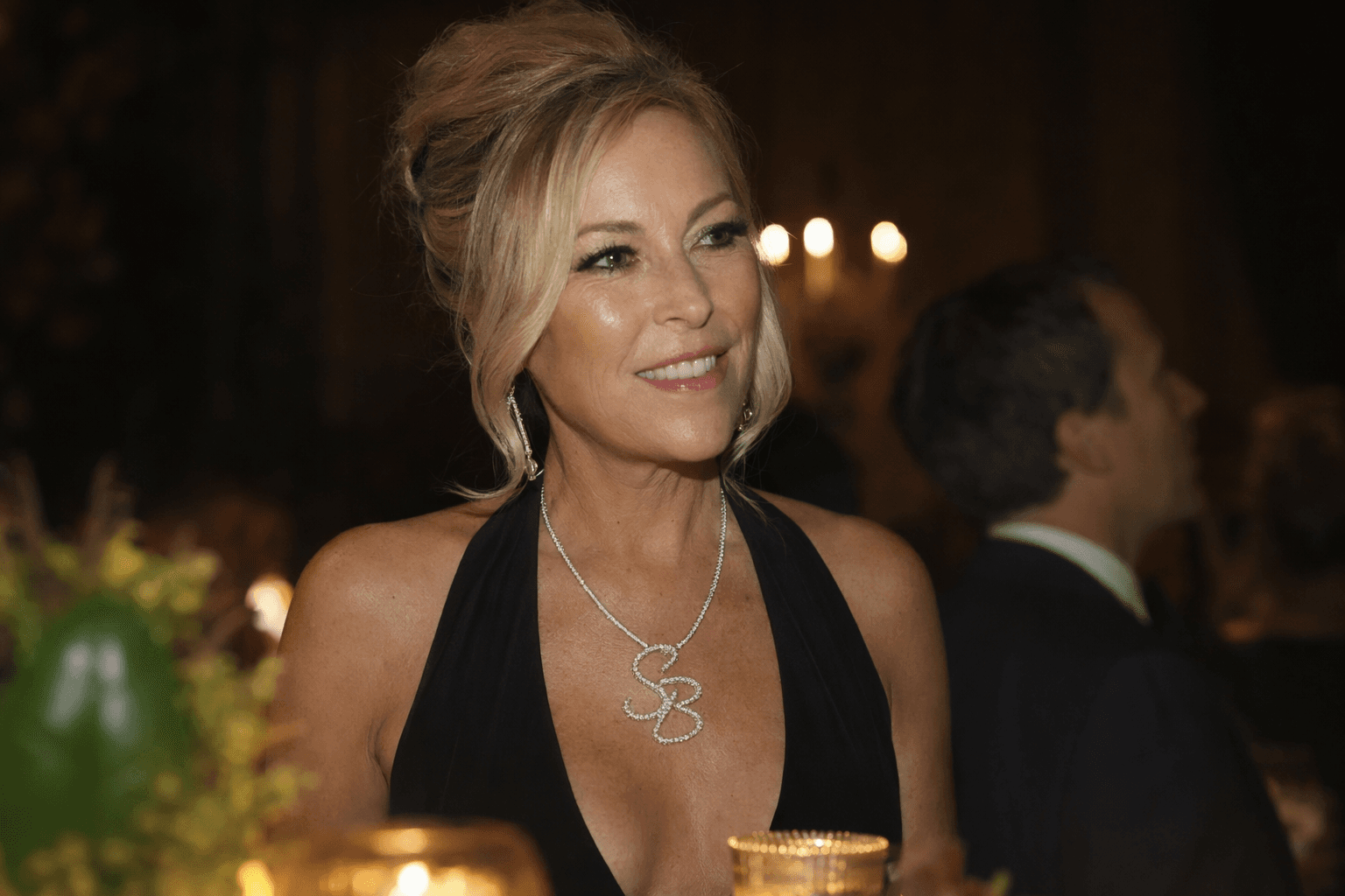 Sutton Stracke debuts custom diamond monogram necklace after divorce