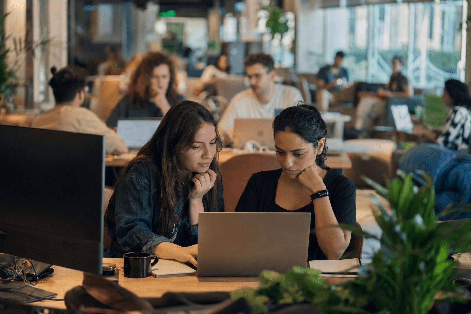 Monday.com hiring pages emphasize equity, AI training, and flexible perks