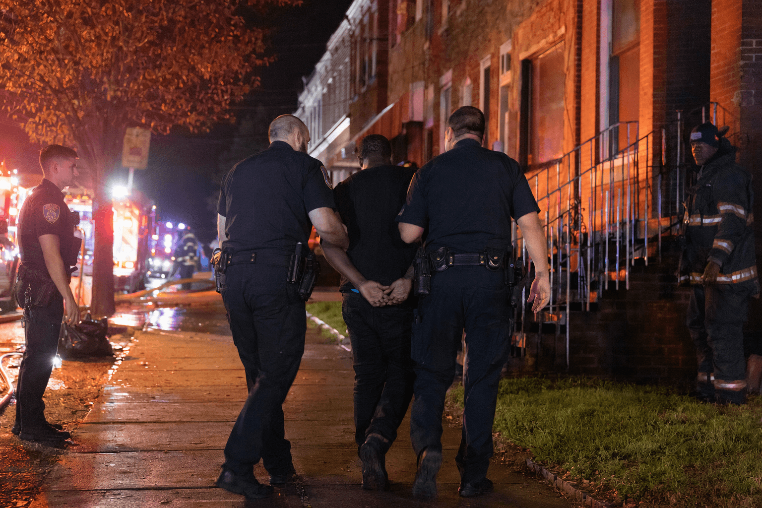Baltimore police arrest armed person after fight at house fire scene