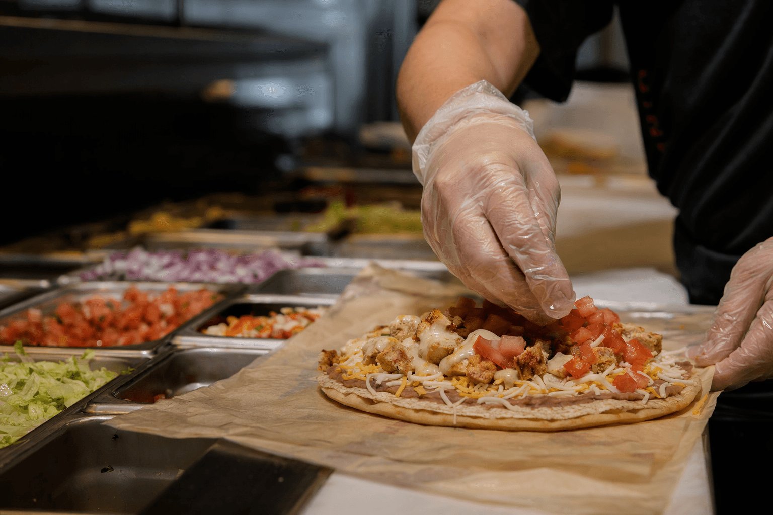 Taco Bell adds Cantina Chicken Mexican Pizza, tests teams again