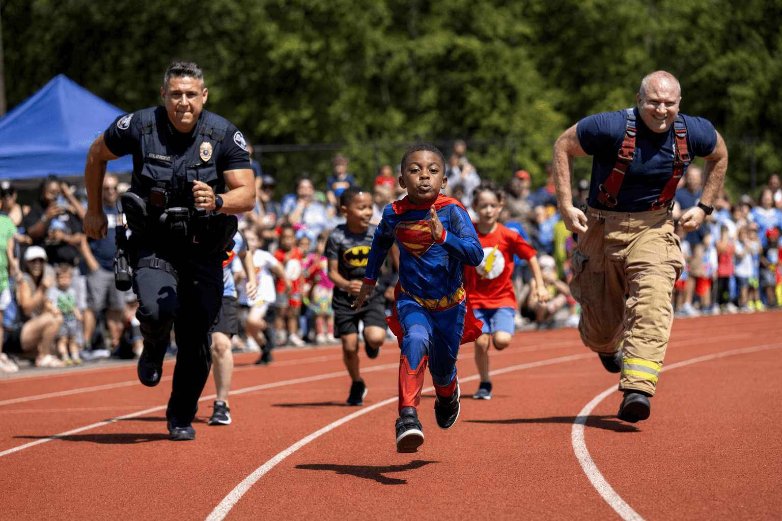 Raleigh kids race police and firefighters in superhero track meet