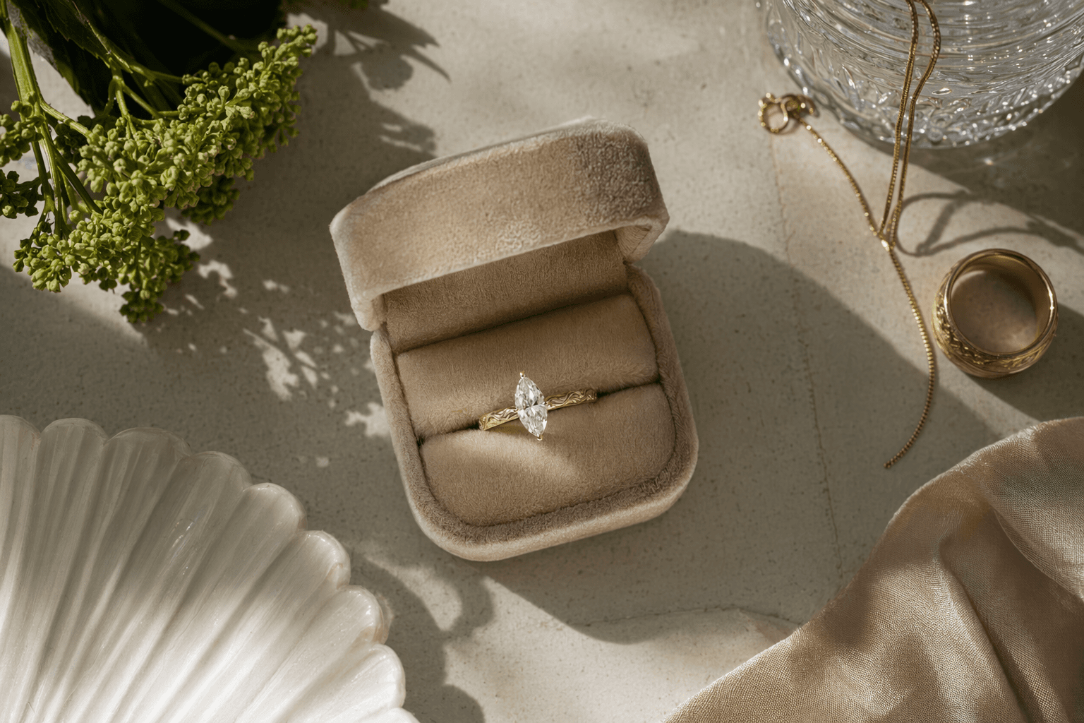 Brooke Miccio announces engagement, marquise diamond and engraved gold band shine